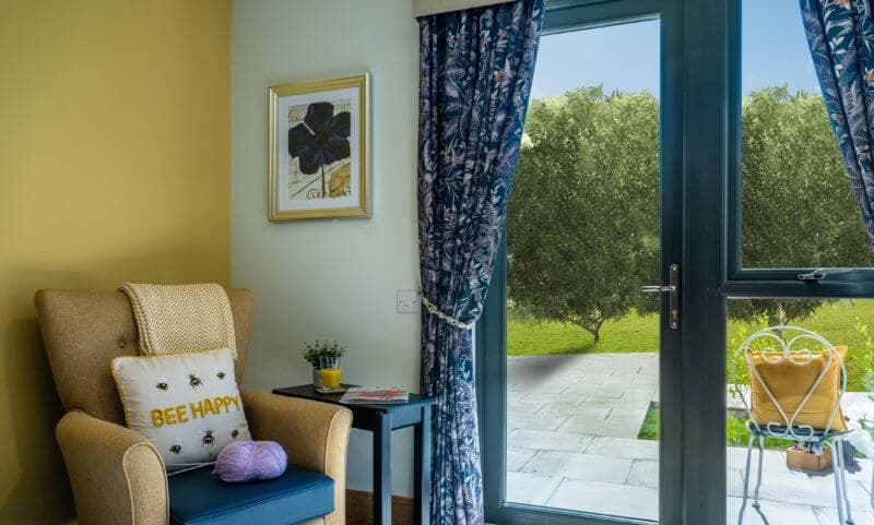 Armchair in Corner of Bedroom by Door