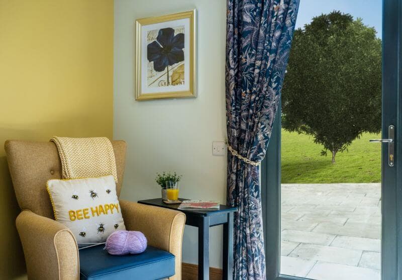 Armchair in Corner of Bedroom by Door