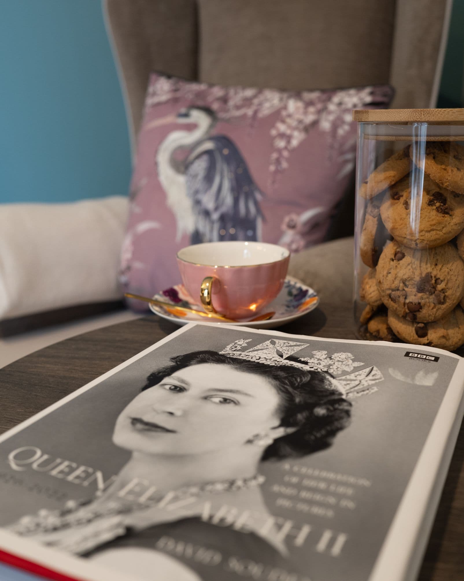 Book & Jar of Biscuits on Table