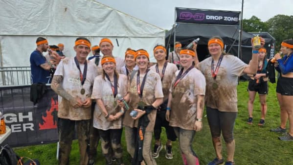 team members after tough mudder at Woodlands care home