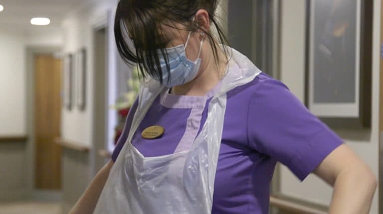 Staff Member Wearing Apron
