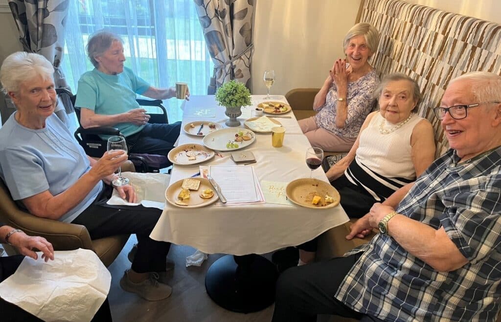 Residents Enjoying Cheese, Crackers & Wine