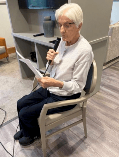 resident singing into microphone