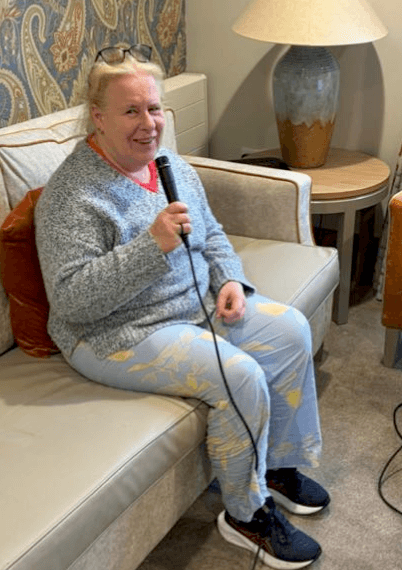 resident singing into microphone