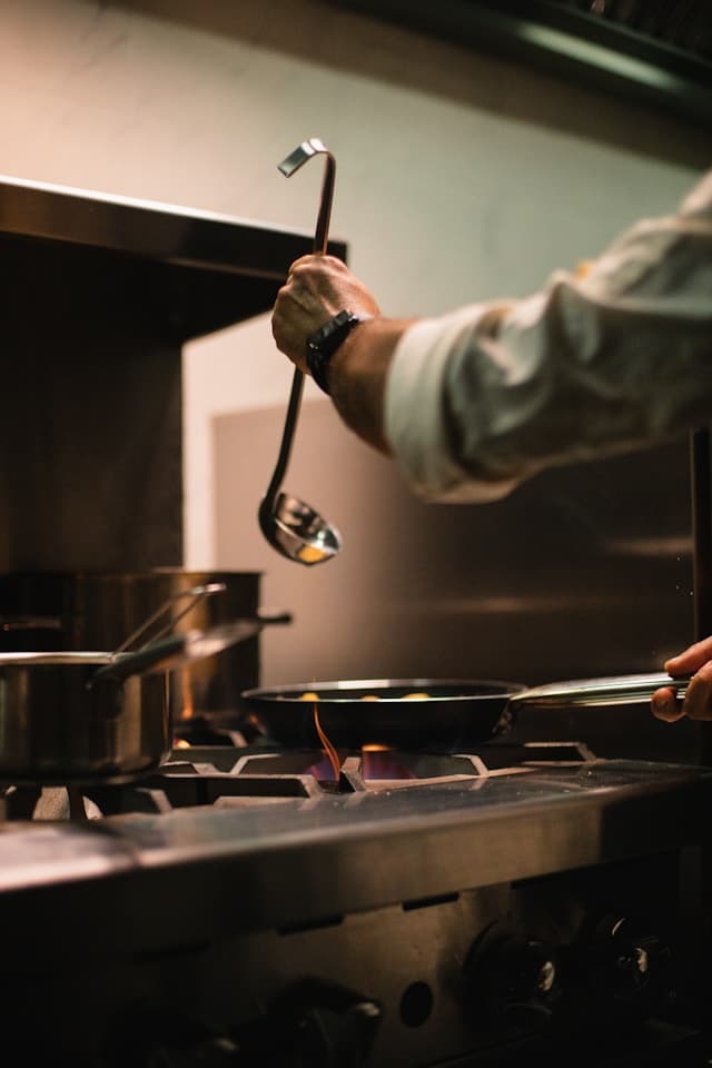 chef making food in a kitchen for residents
